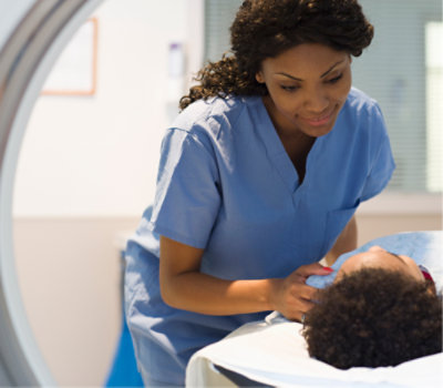 A nurse examining a child's face.