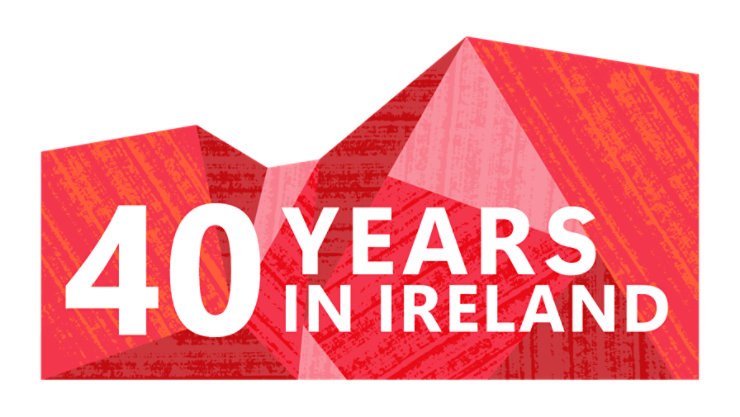 Red geometric design with the text ‘40 Years in Ireland
