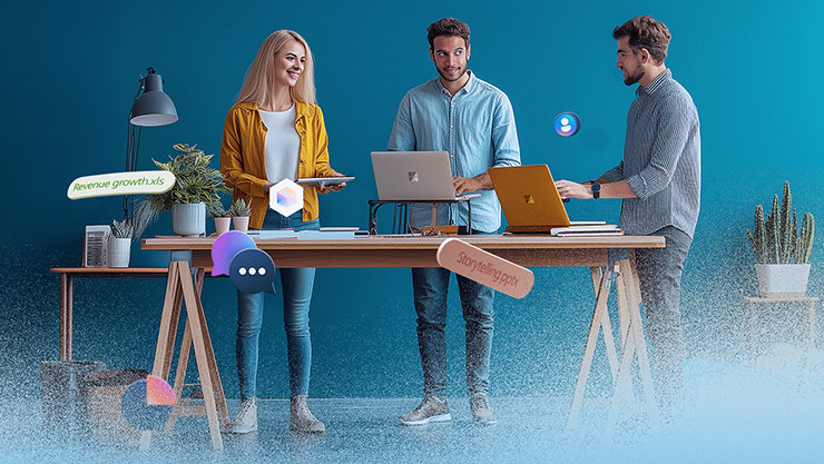 Drei Personen arbeiten gemeinsam an einem Schreibtisch mit Laptops. Verschiedene digitale Symbole schweben um sie herum.