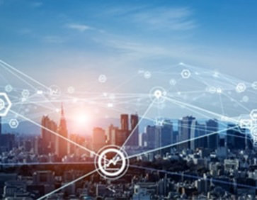 社員のシルエットとビル群