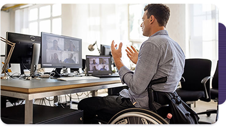 a man in a wheelchair in a work call