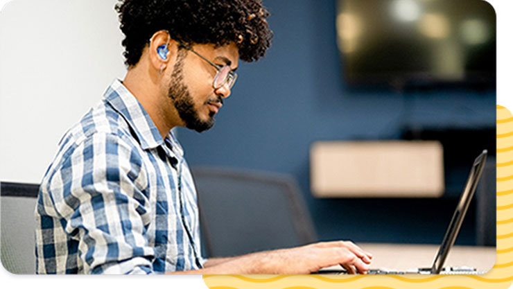 a man in a wheelchair in a work call