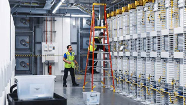 Two people working in a factory