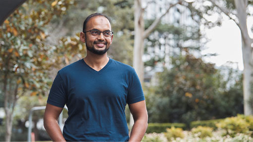 Asif Khan smiling in a park