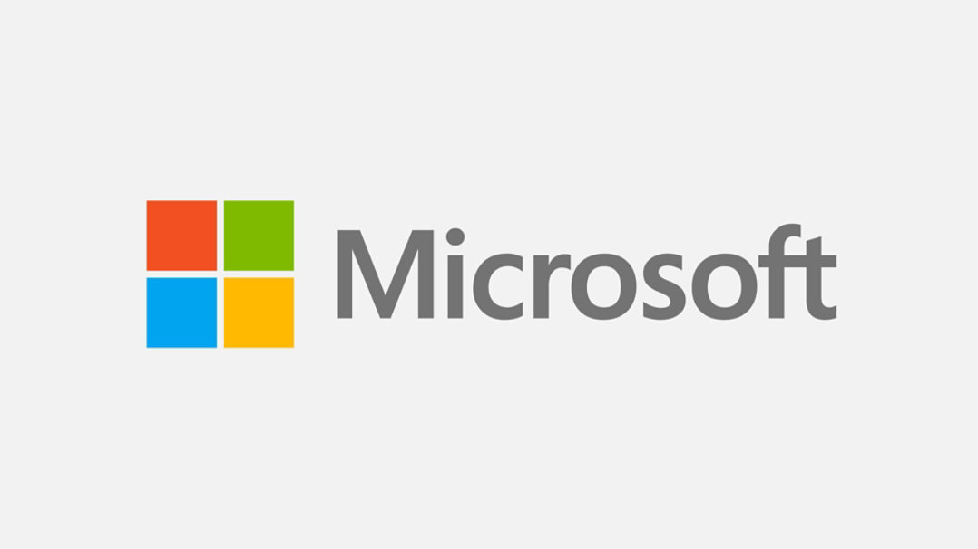 Το λογότυπο της Microsoft. Ένα κόκκινο τετράγωνο, ένα πράσινο τετράγωνο, ένα μπλε τετράγωνο και ένα πορτοκαλί τετράγωνο και η λέξη «Microsoft».