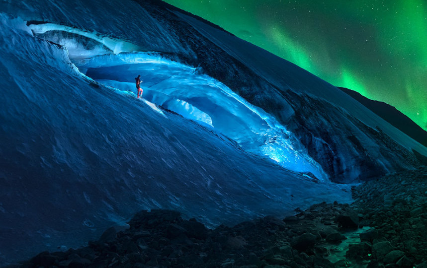 A man watches an aurora borealis in Canada.