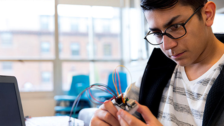 A person working on an electronic device