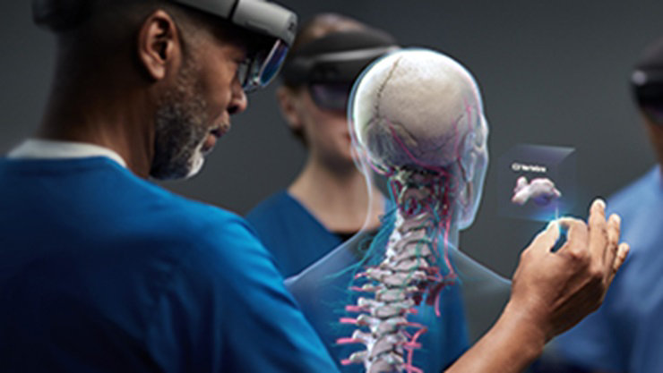 Man wearing mixed reality goggles to view a virtual human skeleton