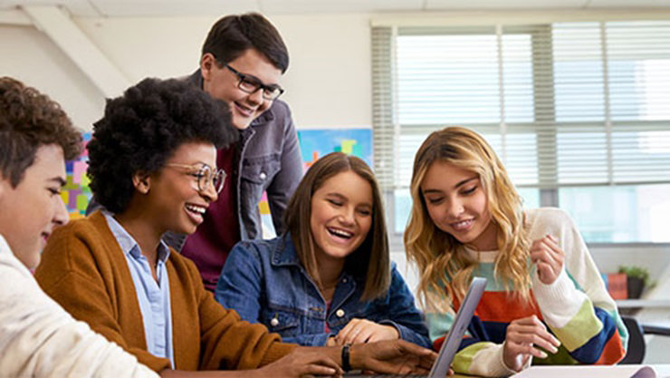 Image of a group of students using a Surface Laptop