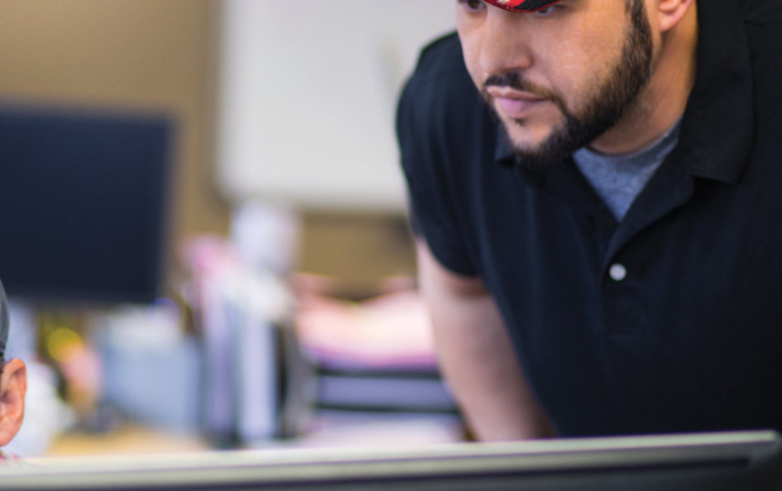 two guys looking at the computer