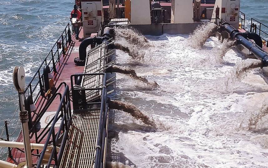 Army Corps of Engineering dredging ship actively dredging
