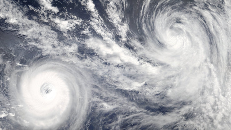 satellite image of hurricane storm cells forming over the ocean