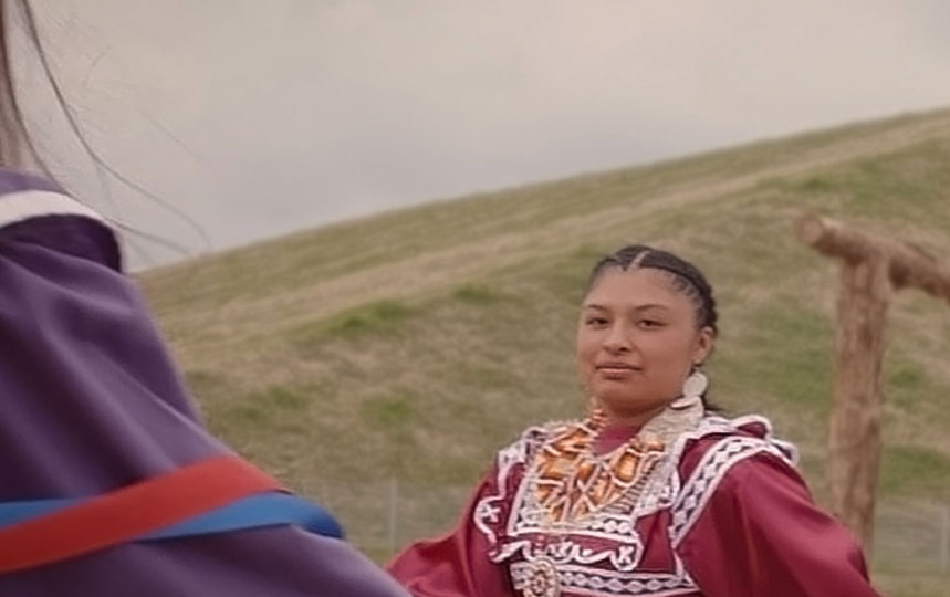 Group of Choctaw women holding hands in a tribal dance