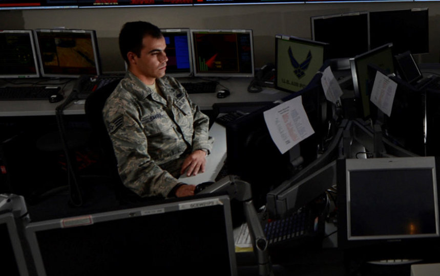 Two U.S. Air Force personnel in a computer room