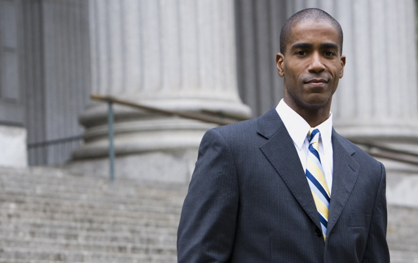 Businessman standing on steps of federal buidling