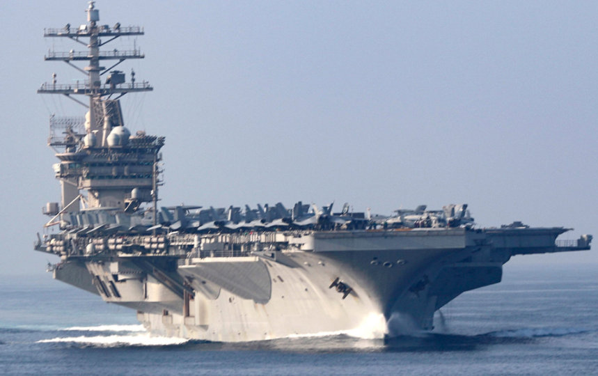 Three U.S. Navy ships in a line at sea