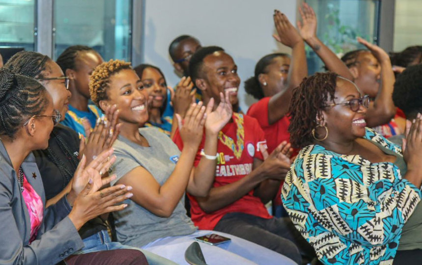 The audience applauding presentations at Microsoft Office