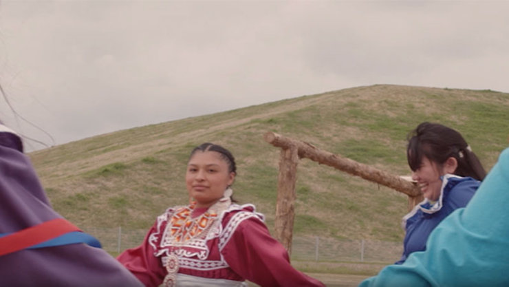 Group of Choctaw women holding hands in a tribal dance