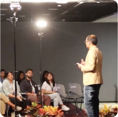 Speaker addressing an audience.