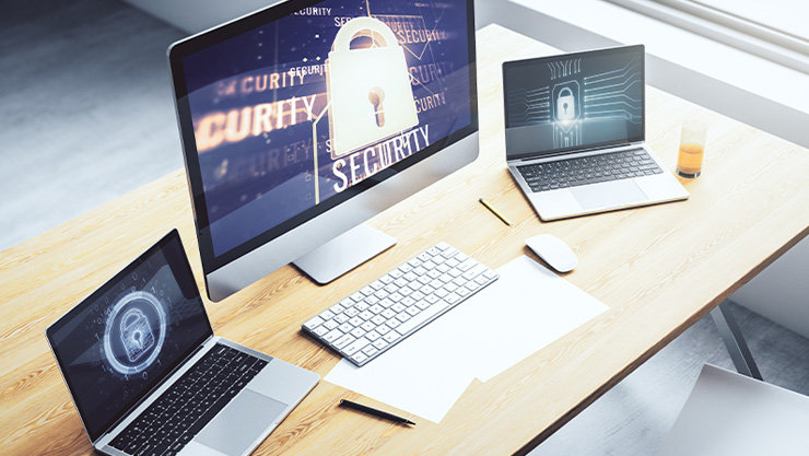 セキュリティのイメージを画面に表示した 3 台の PC