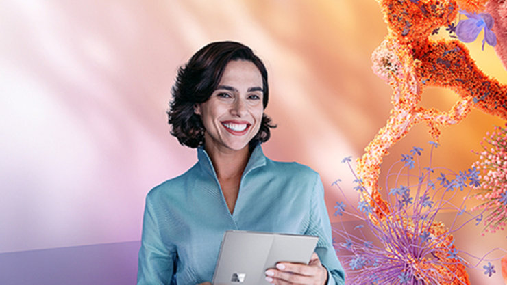 Person mit Tablet vor floralem Hintergrund.