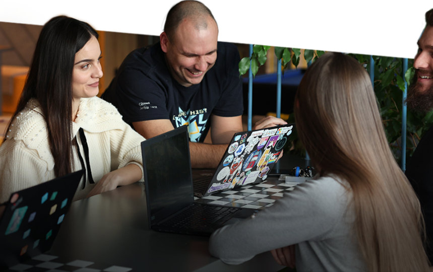 four people talking sitting at the table