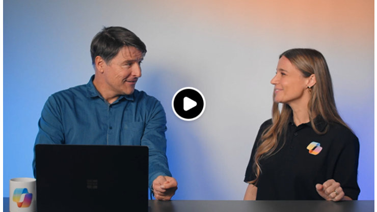 Ein Mann und eine Frau unterhalten sich. Der Hintergrund ist in blau-oranges Licht getaucht; neben dem Laptop befindet sich ein Junges.