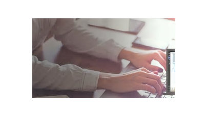 woman typing on laptop