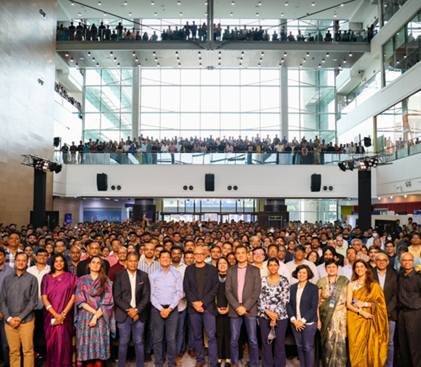Group photo with large number of Microsoft employees with Satya Nadella at the centre.