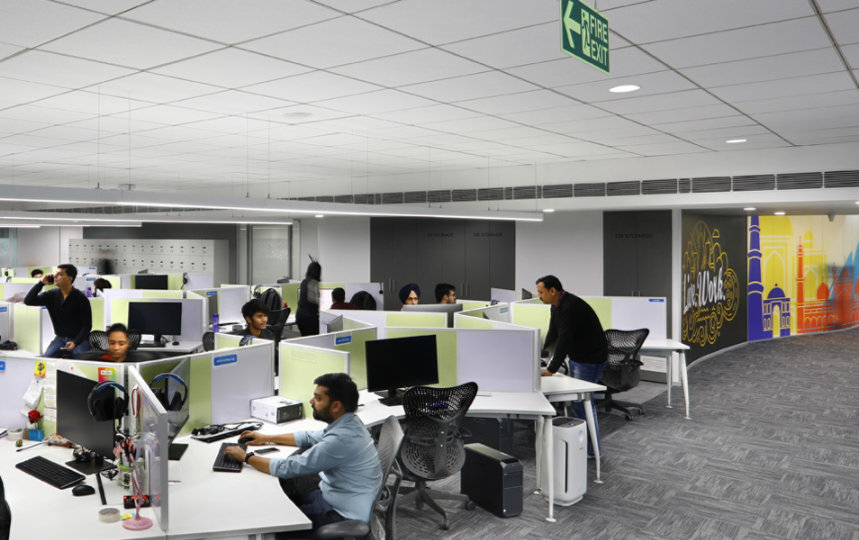 People working at their workstations in an office