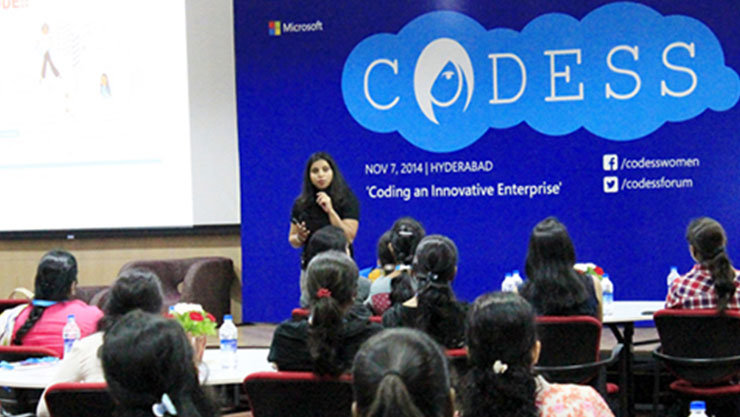 A female engineer giving a talk at the Codess event