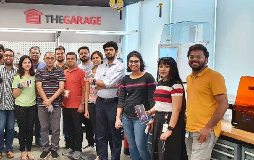 guys posing for camera inside office