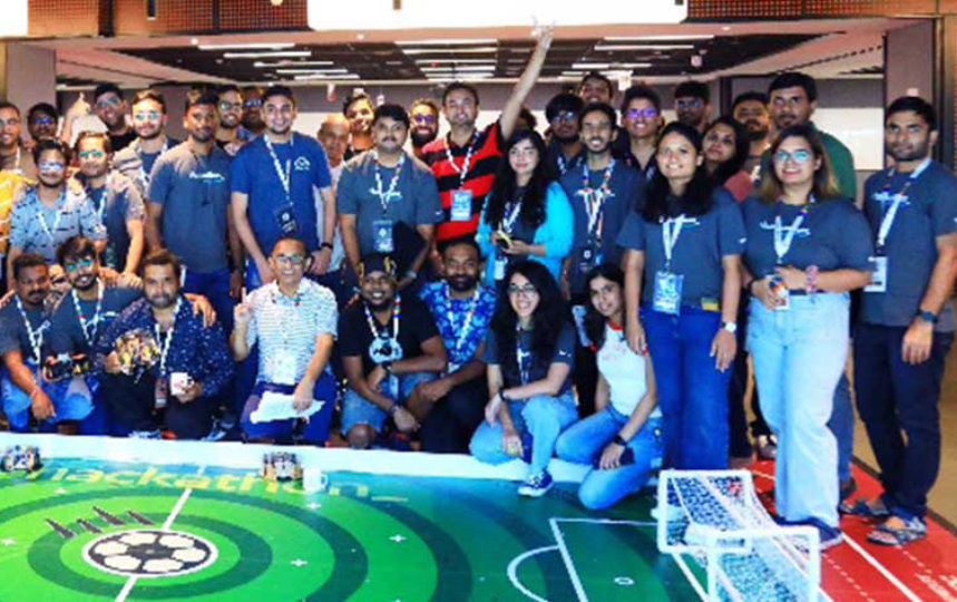 guys posing for camera with football playground platform