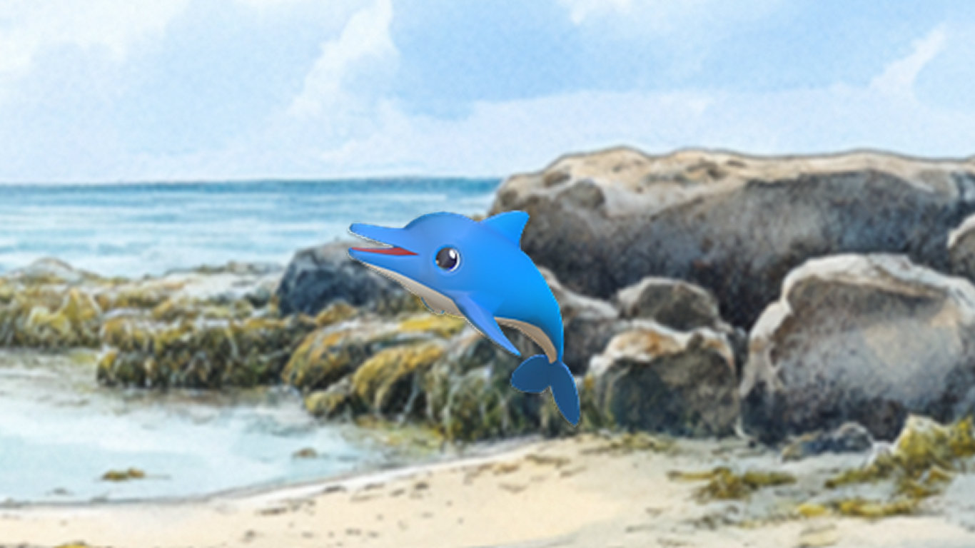 砂浜と岩場の海岸を背景にした、かわいい青いイルカのキャラクター。