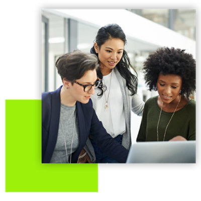 Three women discussing something looking at their laptop screen
