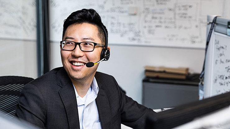 A male salesperson in the contact center