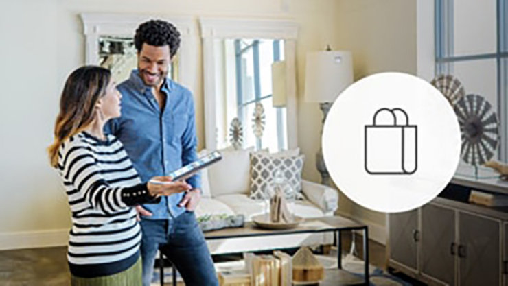 staff showing the customer items in-store