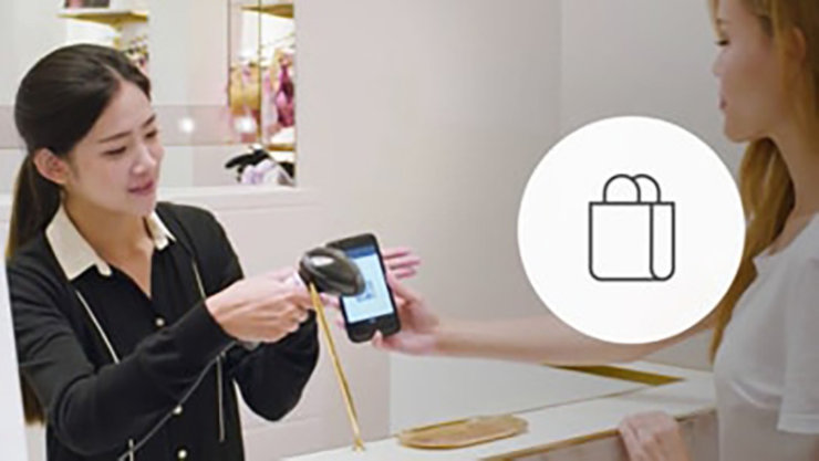 staff scanning a code for a customer