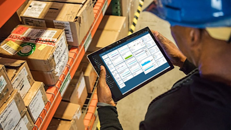 A guy using a device showing the Azure app
