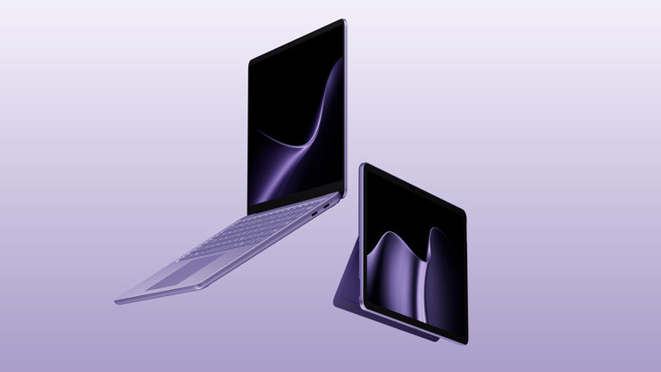 異なる角度で配置された2台の紫色のSurfaceデバイス。背景は淡い紫色。