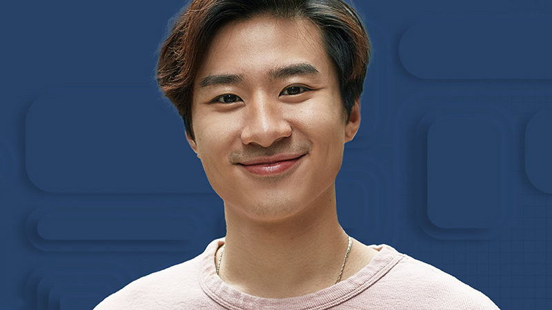 an Asian man smiling