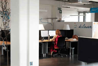 Hands holding a laptop on their lap