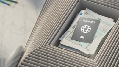 A passport and papers in a file cabinet