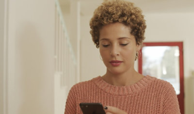 A woman is using her mobile