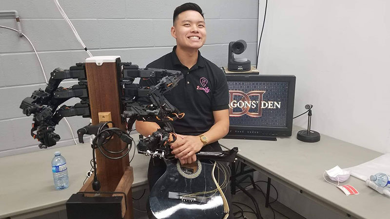 Mitchell Wong working on the set for Dragon's Den