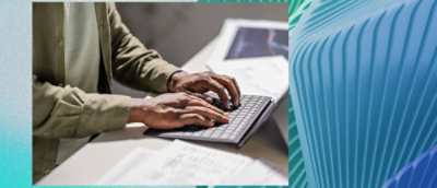 A person typing on a keyboard.