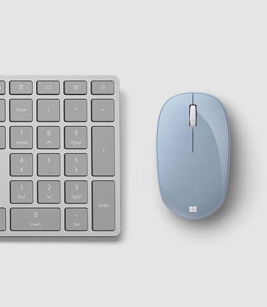 Microsoft Bluetooth® Mouse next to a Surface Keyboard