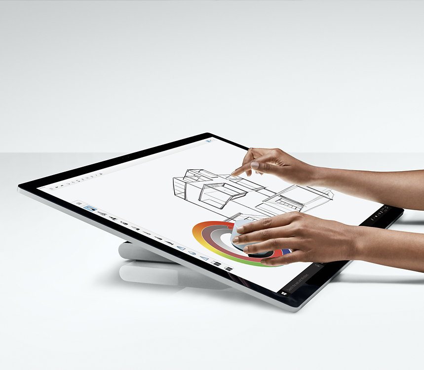 Una persona usa Surface Dial per regolare i colori sullo schermo di Surface Studio 2.