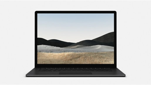 デフォルトの Windows 砂漠の背景が表示された黒い Surface Laptop
