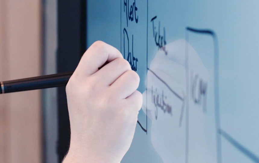 Microsoft engineer working on a whiteboard